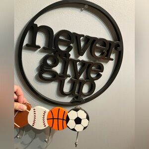Black Metal 'Never Give Up' Wall Decor and Sports Hooks